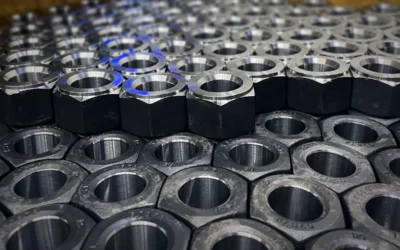 Crate of finish-machined large hex nuts Crate of finish-machined large hex nuts